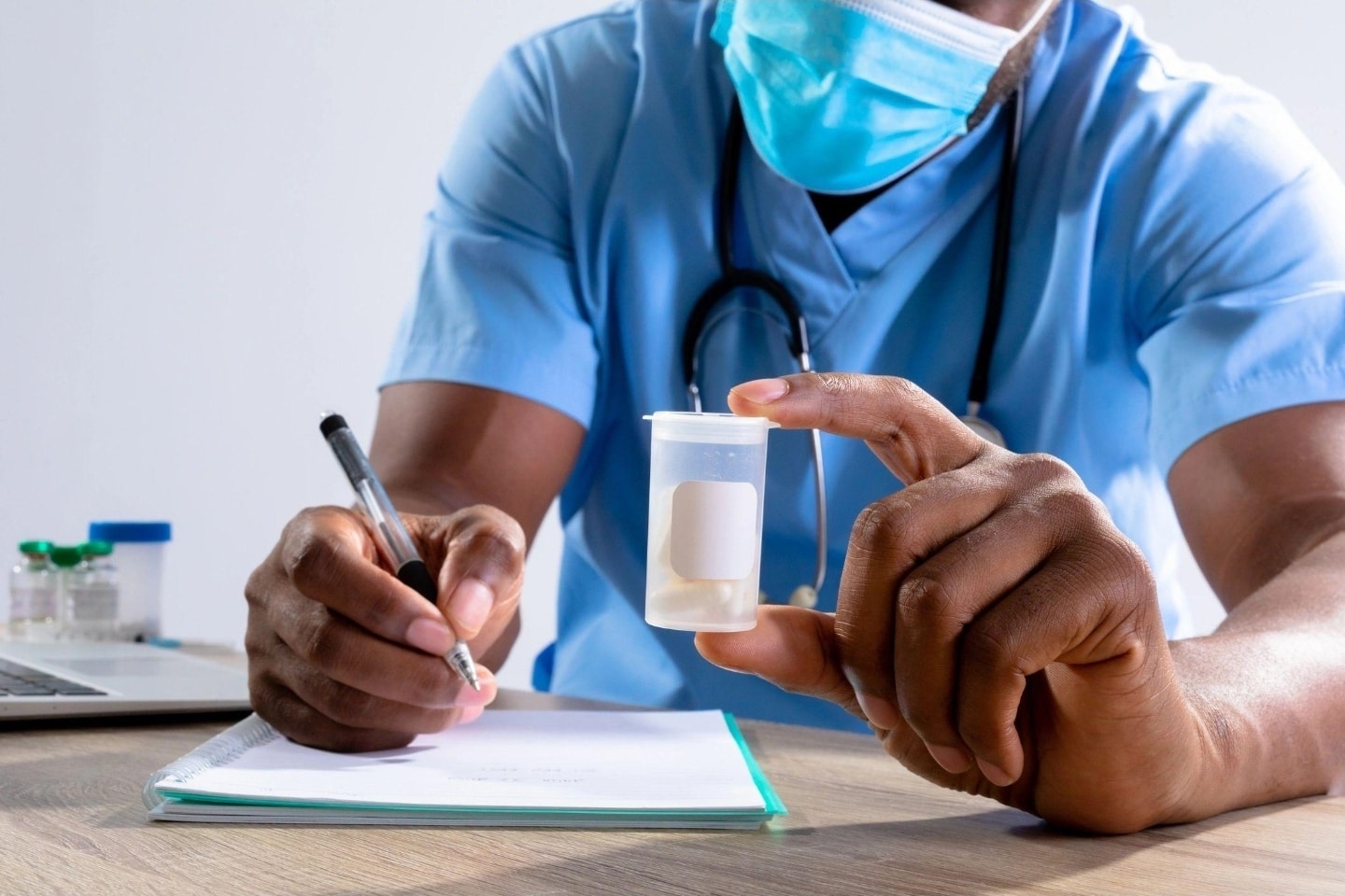 Medical professional documenting a specimen collection